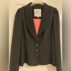 Dressy black blazer with salmon colored lining.